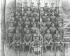 No5 Platoon, 128th Battalion.  George Ridgeway seated 5th row from the front, second from the left.