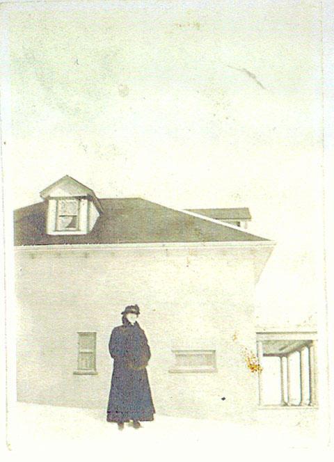 Unknown woman and house