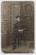 Pte. William McLeish in uniform, sitting, taken at German P.O.W. Camp Rennbahn, 1916, WWI